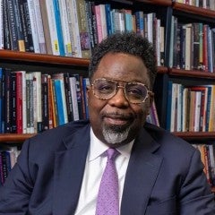 Sherwin Bryant in front of bookcase